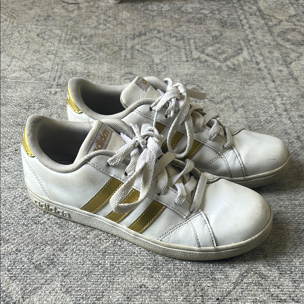 Adidas White Sneakers with Gold Stripes